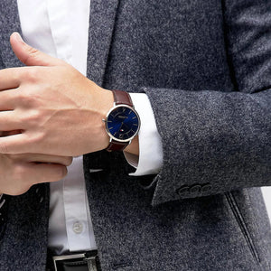 Tommy Hilfiger James 1710354 herrklocka med brunt läderarmband och roséfärgad boett, visad framifrån.